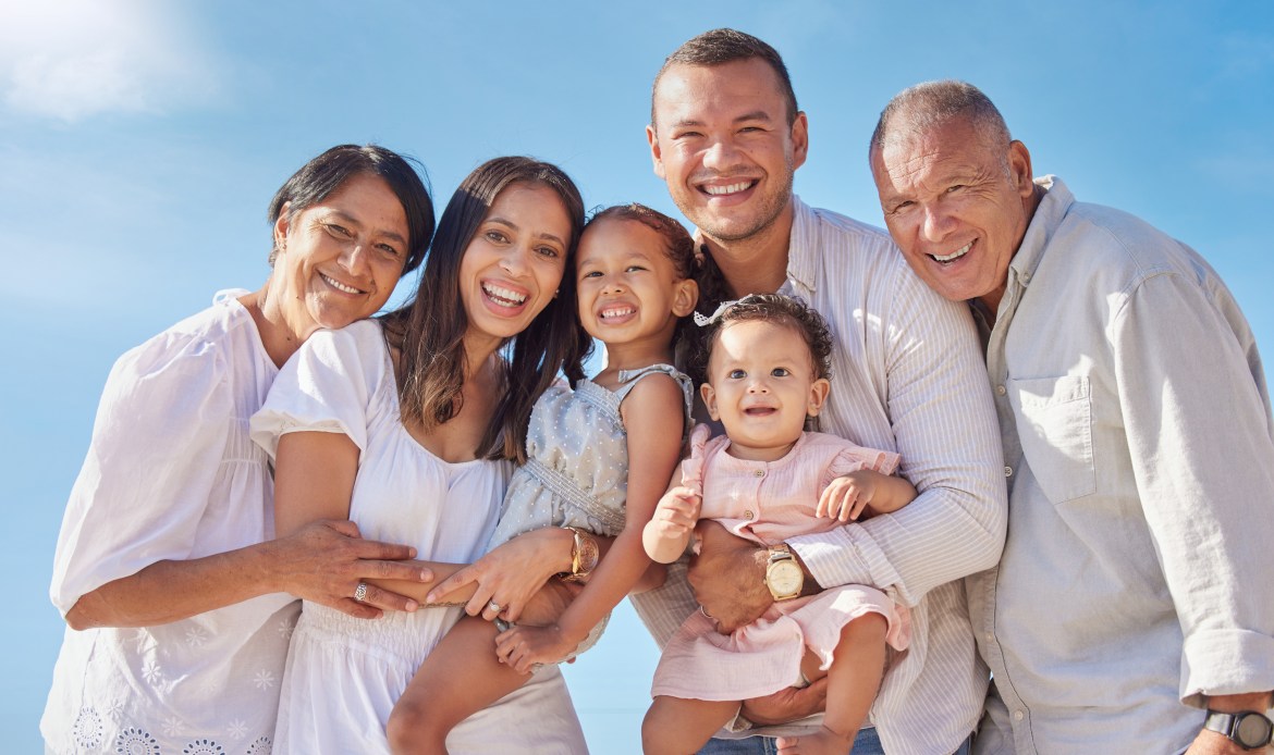 Happy family outside their Muskegon area home